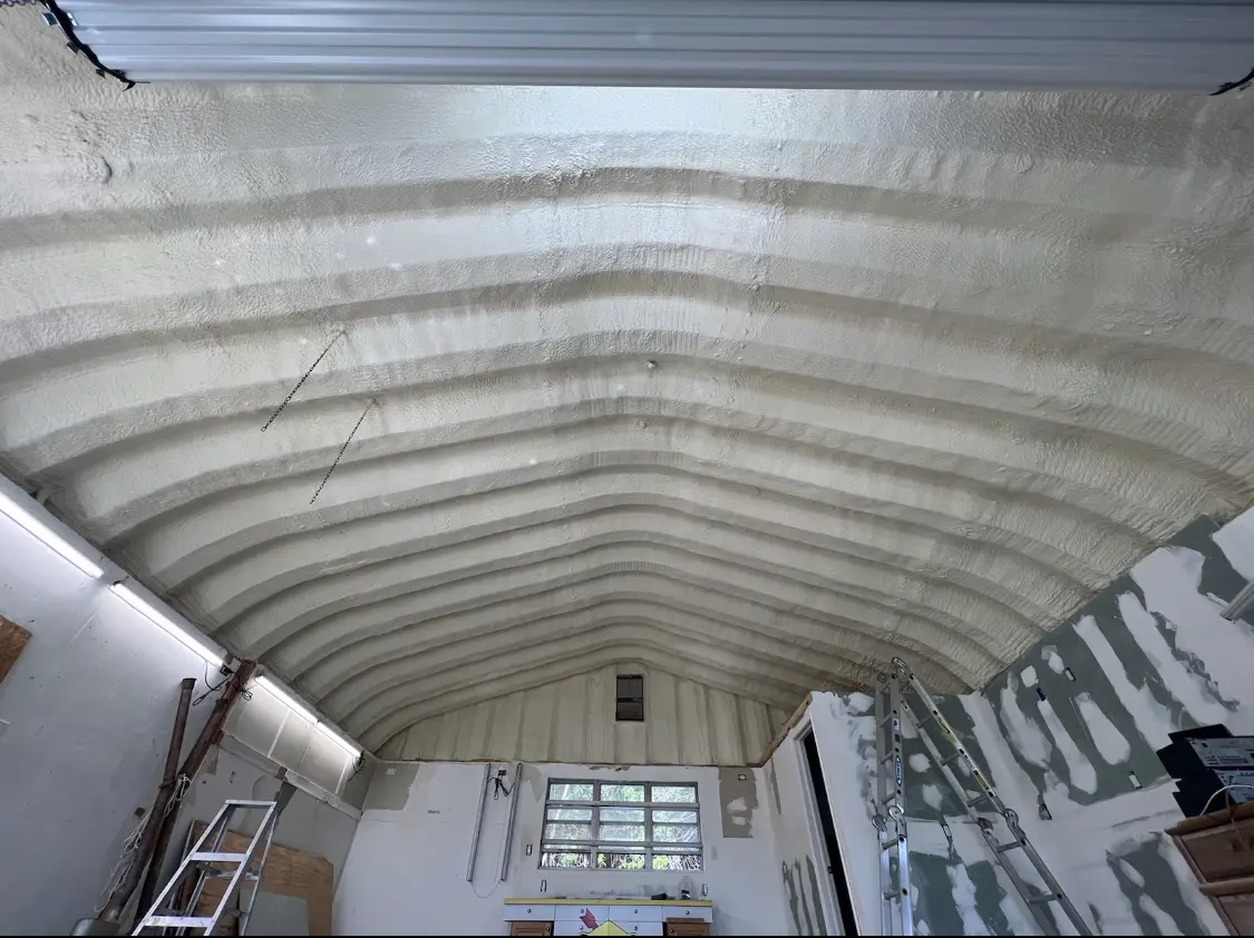 Spray polyurethane foam applied to the underside of a metal roof deck in South Elgin
